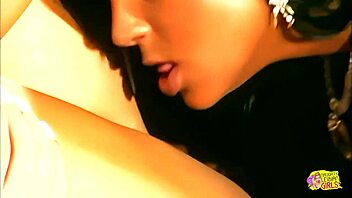 oily brunette lesbian moans as girlfriend fingers and licks her pierced pussy