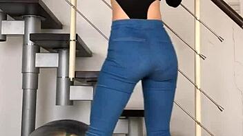 bold chinese babe dances seductively in skin-tight jeans