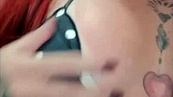 Tattooed redhead shows off tan lines while teasing her big ass closeup