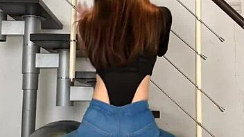 bold chinese babe dances seductively in skin-tight jeans