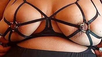 Madura Latina flaunts huge natural tetas in fishnets