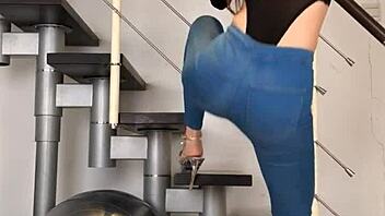 bold chinese babe dances seductively in skin-tight jeans