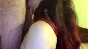 that amateur shemale teen kneels to slurp her lover's throbbing cock hungrily