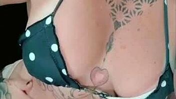 Tattooed redhead shows off tan lines while teasing her big ass closeup