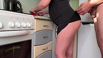 Stepson spies pregnant stepmom's panty-free kitchen tease