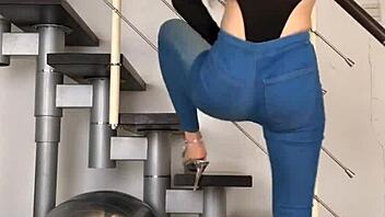 bold chinese babe dances seductively in skin-tight jeans