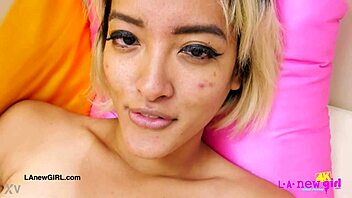 Gorgeous Asian Brunette Model Poses Seductively on Sofa