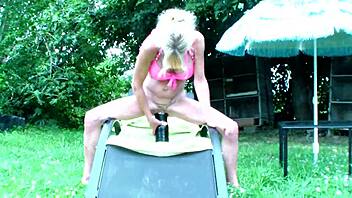 Annabelle Dangel shoves bottle deep in garden for wild insertion play