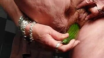 oma shove cucumber deep in hairy granny pussy now