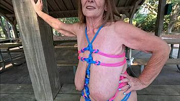 Granny bound in ropes flashes huge saggy tits?