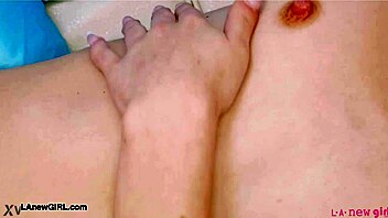 redhead model poses nude showing off her sexy petite body