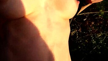 a young woman adjusts her panties after outdoor park encounter in stockings