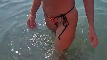 Horny beach milf couple chats tits ass with voyeurs