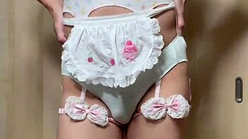 Cute Japanese maid plugs ass in public toilet