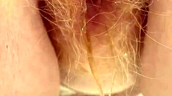 redhead pees revealing her hairy pussy secrets