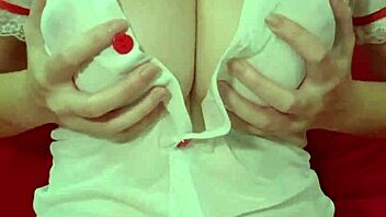 pretty blonde in see through dress bounces huge fake tits closeup