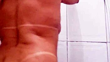 blonde milf shoves dildo deep in pussy in bathroom solo