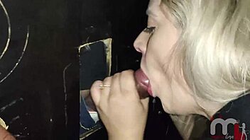 blonde slut mysteriously fucks strangers through gloryhole wall