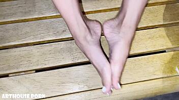 Petite Latina's oily footjob heats up sauna