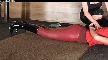 woman struts in tight latex leggings through public outdoor spots