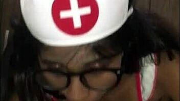 latina nurse tends to young patient in hospital