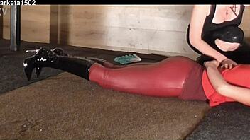 woman struts in tight latex leggings through public outdoor spots