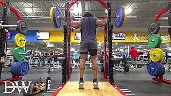 Athletic bodybuilder does fullbody workout routine