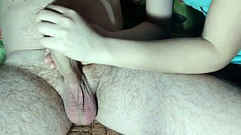Skillful Asian girl jerking off and sucking a big cock