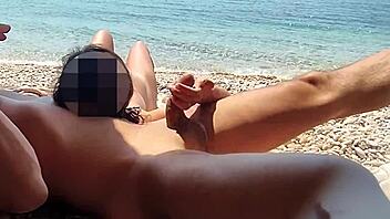 Caught on beach during handjob fun