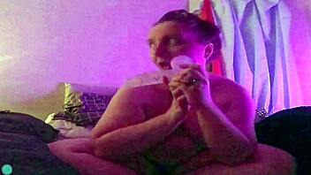 Dildo fellatio on the bed with blindfold and teasing