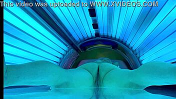 woman relaxes in public tanning bed
