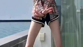 Sexy Chinese girl Chen Yi Li poses outdoors