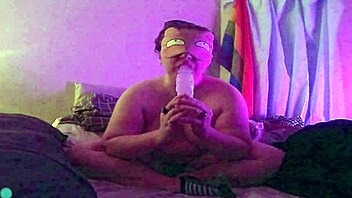 Dildo fellatio on the bed with blindfold and teasing