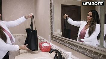 Latina bends over and spreads in bathroom