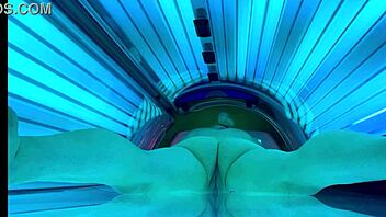woman relaxes in public tanning bed