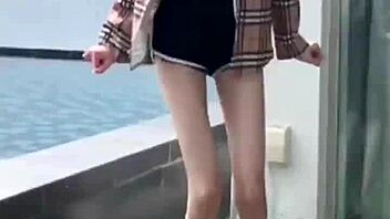 Sexy Chinese girl Chen Yi Li poses outdoors