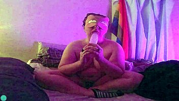 Dildo fellatio on the bed with blindfold and teasing