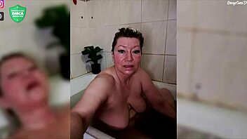 Aimee shaves and fingers her mature pussy in the shower