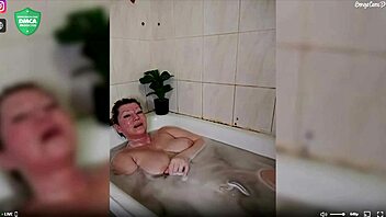 Aimee shaves and fingers her mature pussy in the shower