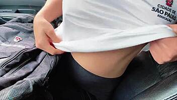 Shameless schoolgirl flashes teacher inside parked car