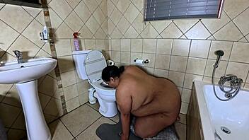Playing with my fat pussy while licking the toilet