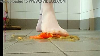 Feet play with fruit in pantyhose feels good