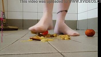 Feet play with fruit in pantyhose feels good