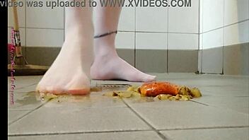 Feet play with fruit in pantyhose feels good
