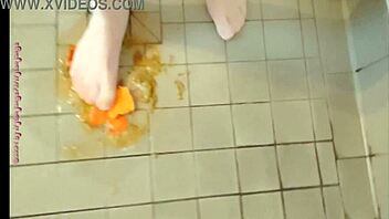 Feet play with fruit in pantyhose feels good
