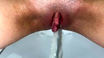 See that shaved pussy pissing in lace lingerie close up pov