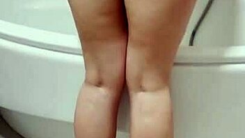 Ukrainian young girl enjoys solo shower masturbation in HD