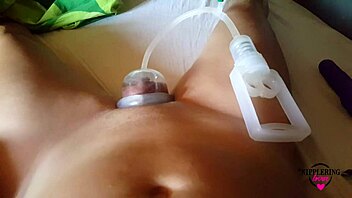 Big pussy lips and pierced clithood get pumped with a nipple pump