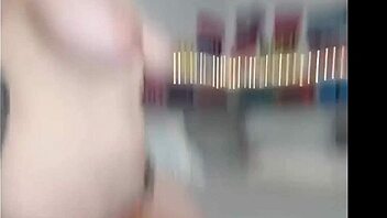 Big-breasted beauty flaunts her assets on megacam